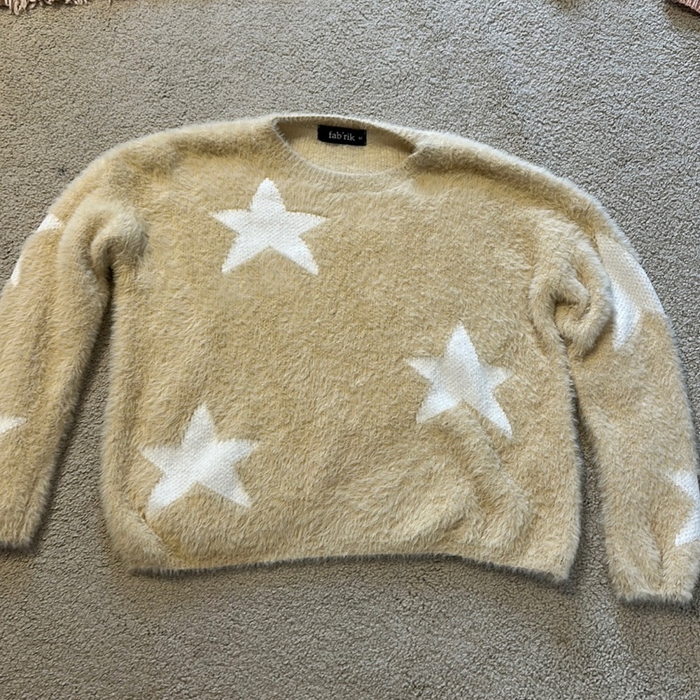 cream sweater with white stars